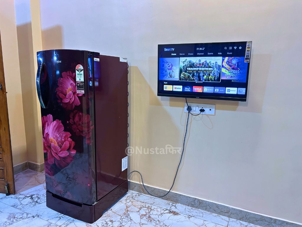 Living Room with Double-Door Refrigerator & Smart TV