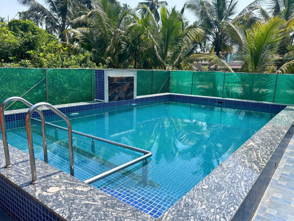 Crystal-Clear Turquoise Pool & Chrome Ladder