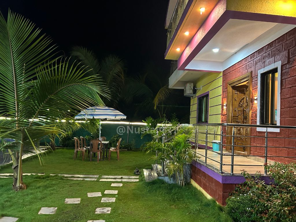 Night Lawn Sitout with Umbrella Seating & Boundary Lighting
